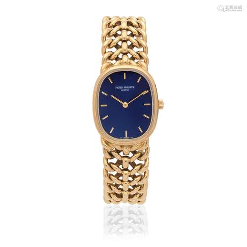 Patek Philippe. A lady's 18K gold manual wind bracelet watch...