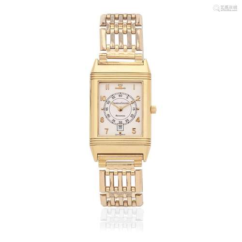 Jaeger-LeCoultre. An 18K gold quartz calendar reversible bra...