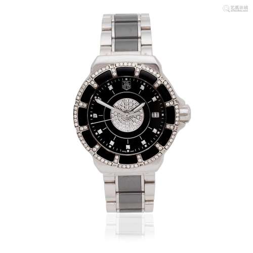 TAG Heuer. A lady's stainless steel and black ceramic quartz...