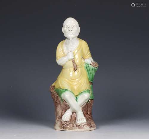 China, sancai-glazed figure of a peasant, 19th century,