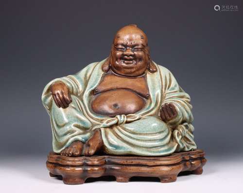 China, celadon-glazed and biscuit figure of Budai, 20th cent...