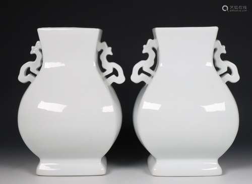 China, pair of white-glazed archaistic vases, fanghu, modern...