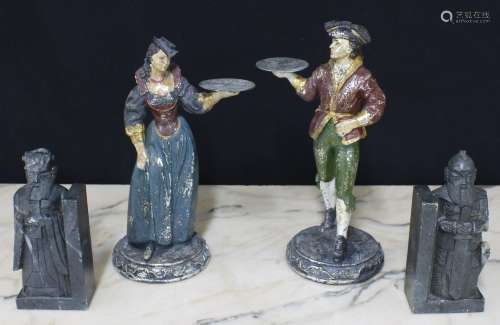 Pair of polychrome and silvered figural dumb waiters, modell...