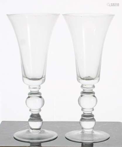 Pair of large baluster glass trumpet vases, raised on knoppe...