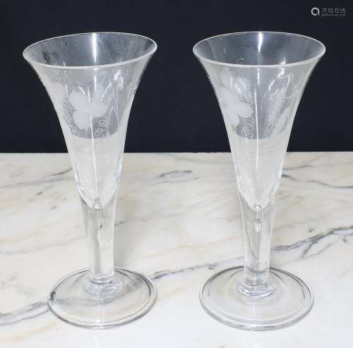 Pair of antique glass trumpet vases, the bowls with engraved...