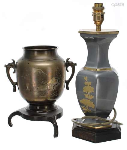 Japanese bronze urn on tripod stand, decorated with a waterm...