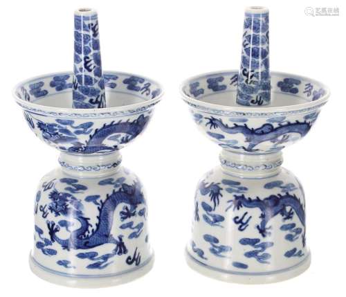 Pair of Chinese export blue and white porcelain candlesticks...