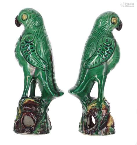 Pair of Chinese green glazed porcelain parrots, with yellow ...