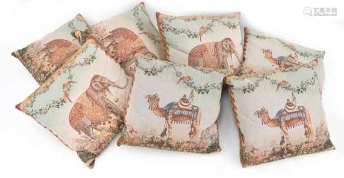 Seven decorative cushions, five decorated with elephants in ...