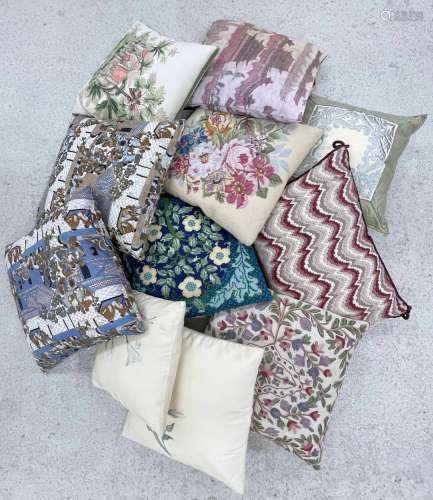 Eleven assorted cushions, primarily floral decorated or with...