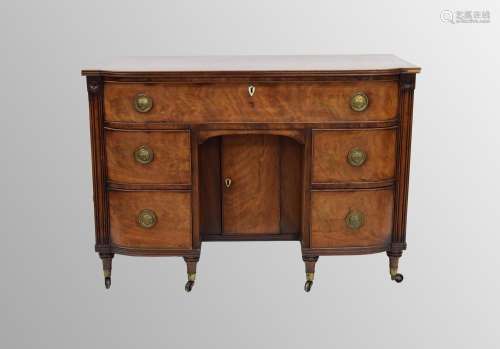 19th century mahogany kneehole bowed dressing table, the lar...