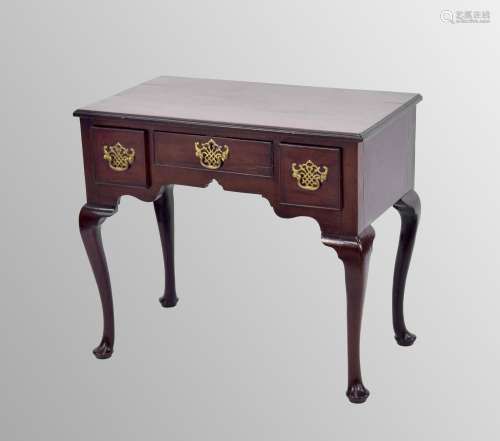 George III mahogany lowboy, the rectangular moulded top over...