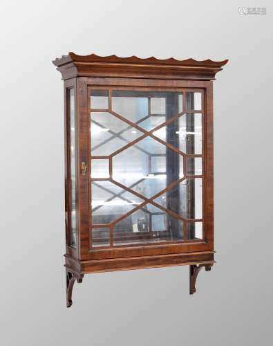 Mahogany glazed narrow wall display cabinet, with a waved ri...