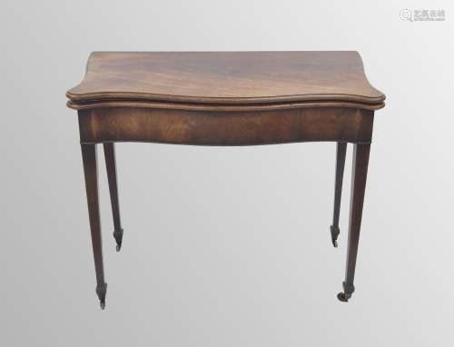 George III mahogany serpentine foldover card table, the hing...