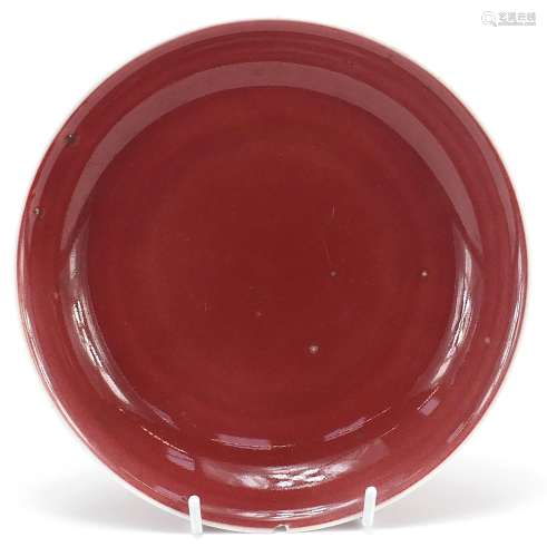 Chinese porcelain shallow dish having a sang de boeuf glaze,...