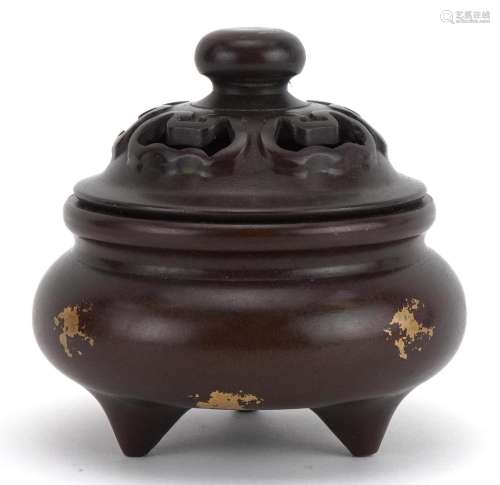 Chinese gold splashed bronze censer with pierced lid, four f...