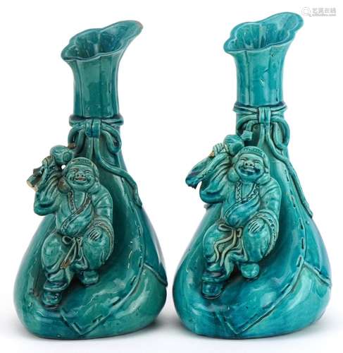 Matched pair of Chinese sack design vases surmounted with fi...