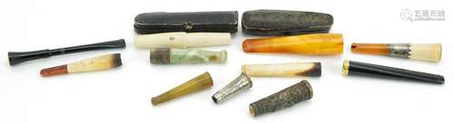 Early 20th century and later cigarette holders and two cases...