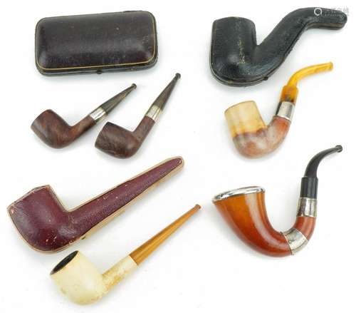 Victorian smoking pipes, four with silver mounts including a...