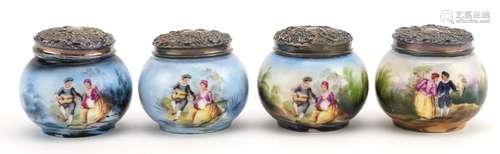 Four Victorian porcelain pots with embossed silver lids, eac...