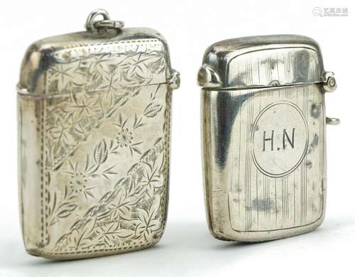 Two rectangular silver vestas including one engraved with fo...