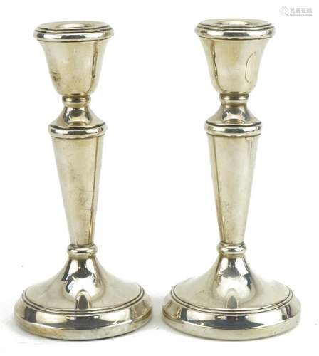 Pair of circular silver tapering candlesticks, D P makers ma...