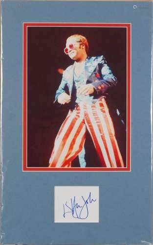 Elton John ink signature display with an image of Elton John...