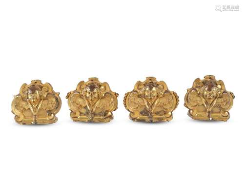 4 appliqués with angel heads, 17th/18th century, Bronze gold...