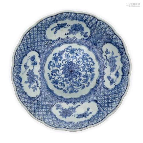 A Chinese blue and white 'lotus' foliate dish with convex ce...