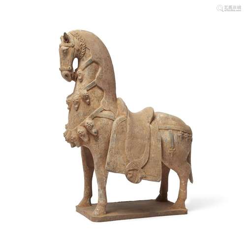 A Chinese pottery figure of a caparisoned horse<br />
<br />...