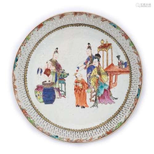 A Chinese famille rose 'ladies and boys' dish with reticulat...