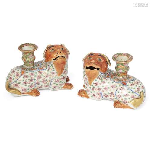 A pair of Chinese canton famille rose 'dog' candle holders<b...