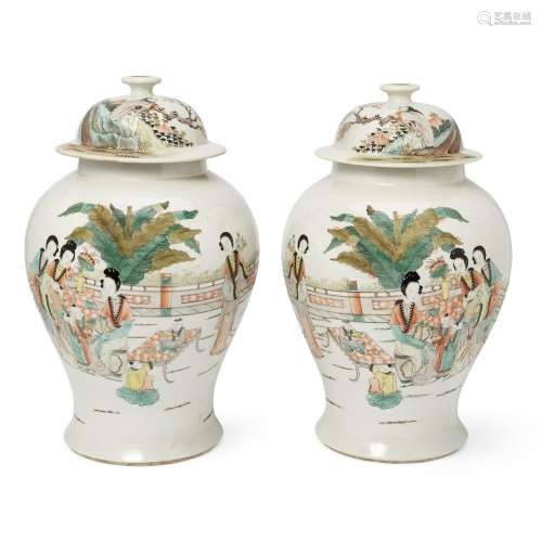 A large pair of Chinese famille verte baluster vases and cov...