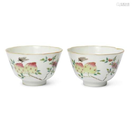 A pair of Chinese famille rose 'peaches and fly' foliate cup...