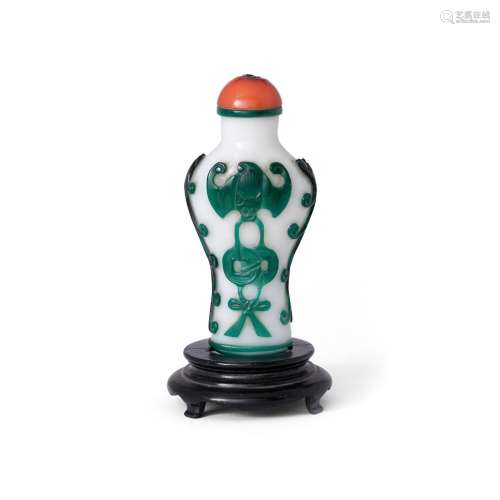A Chinese green overlay glass 'bats and cash' snuff bottle<b...