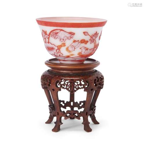 A Chinese red overlay glass bowl and a carved boxwood stand<...