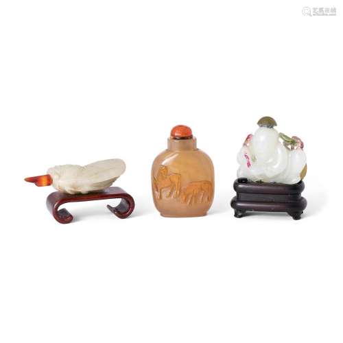 Two Chinese jade and one agate 'silhouette' snuff bottle<br ...