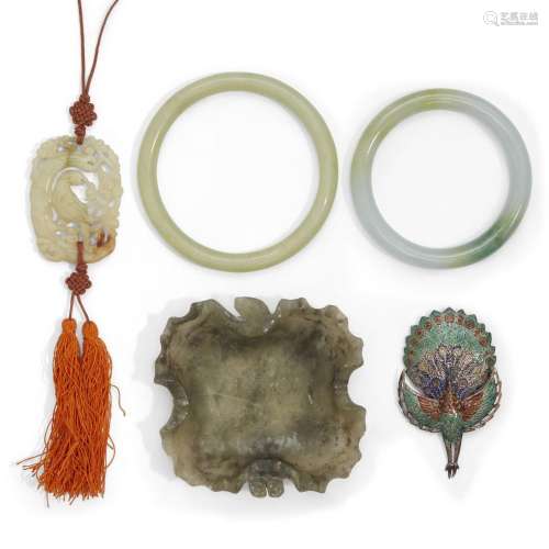 Three jades, one hardstone washer and an enamelled silver br...
