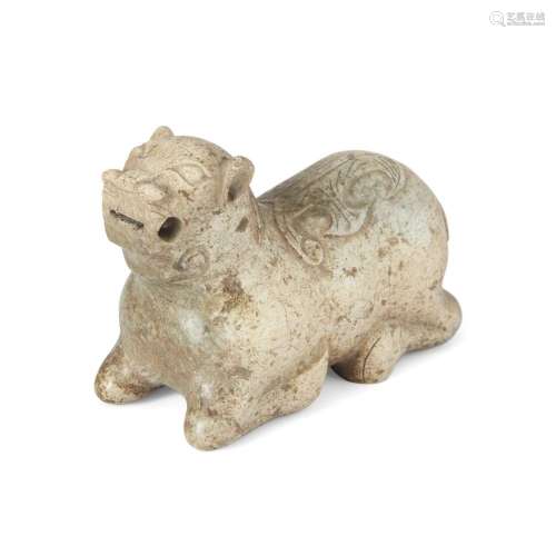 A Chinese 'chicken bone' calcified jade archaistic carving o...