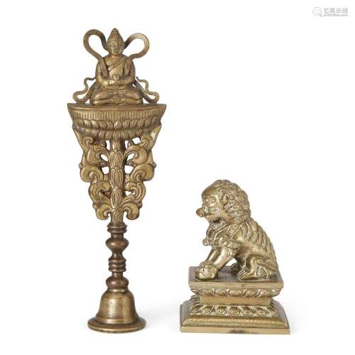 A Chinese bronze Buddhist lion and a gilt Buddhist emblem<br...