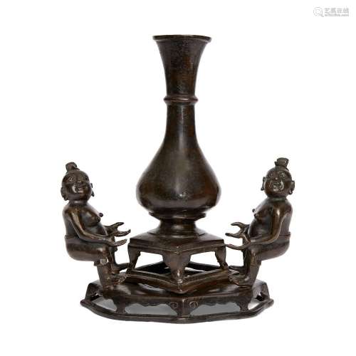 A Chinese bronze vase with figural base<br />
<br />
Ming dy...
