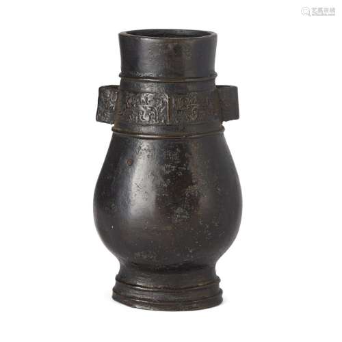 A Chinese bronze flattened pear-shaped vase, hu<br />
<br />...