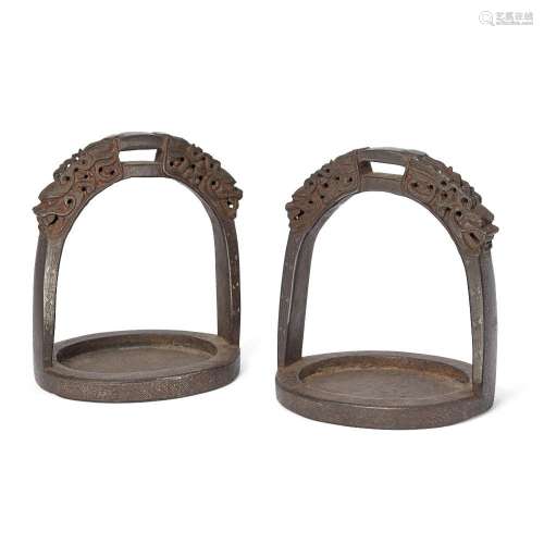 A pair of Chinese silver-damascened stirrups<br />
<br />
Qi...