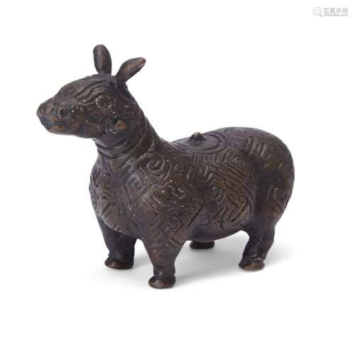 A Chinese archaistic bronze figure of a tapir<br />
<br />
2...