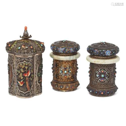 A pair of Chinese silver filigree covered jars and a similar...
