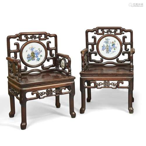 A pair of Chinese hongmu porcelain set armchairs<br />
<br /...