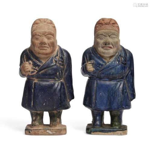 A pair of Chinese pottery Tang-style dwarf figures<br />
<br...