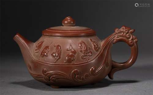 A CHINESE YIXING GLAZED TWELVE ZONDIAC TEAPOT