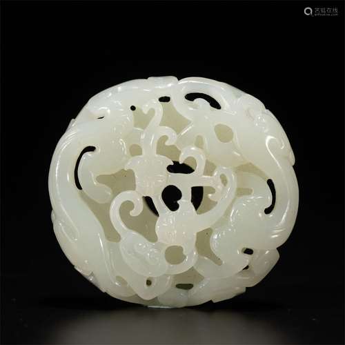 A CARVED JADE BI ORNAMENTS