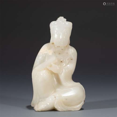 A WHITE JADE FIGURE OF BUDDHA